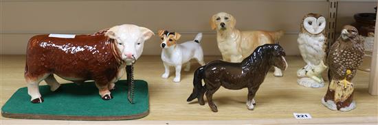 A Melba ware bull and four Beswick figures and another